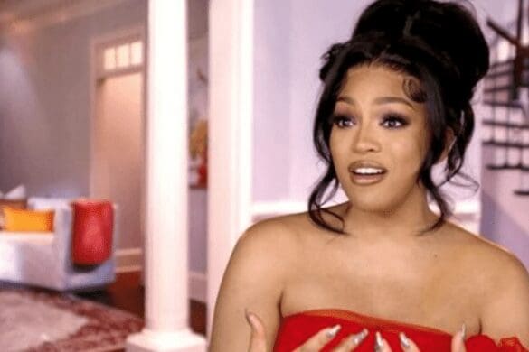 Drew Sidora wears a red strapless dress in RHOA season 15 confessional interview