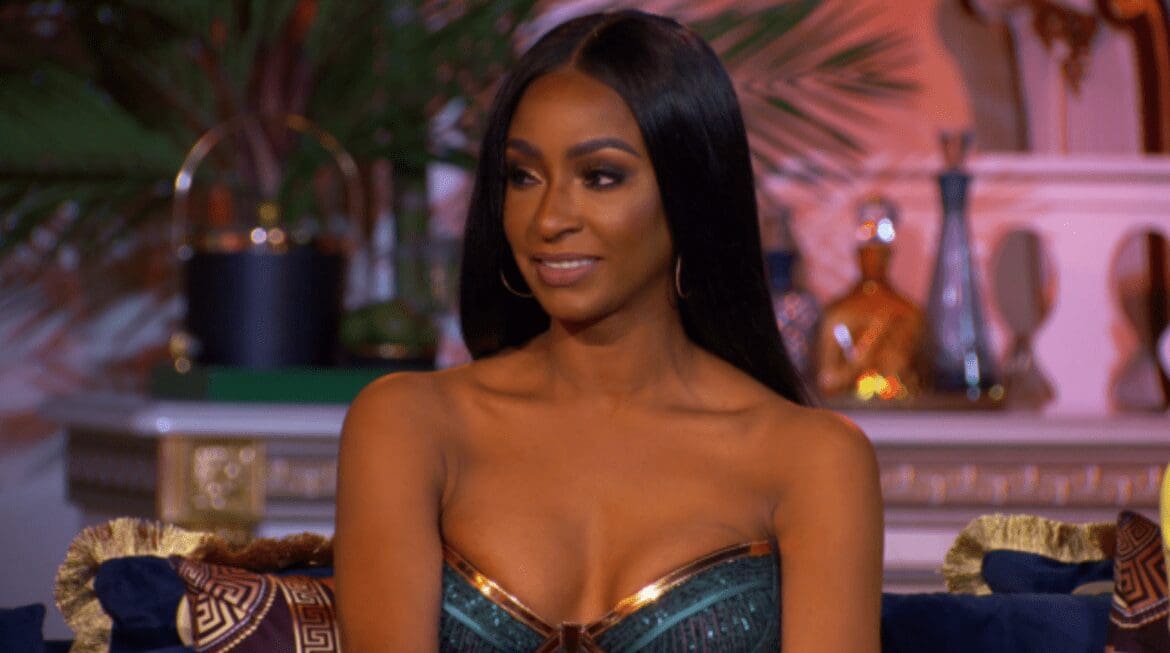 rhom-guerdy-abraira Guerdy Abraira wearing gold and teal sequin gown at RHOM season 4 reunion