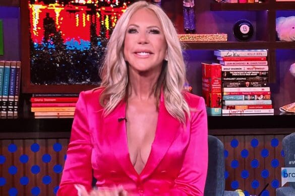 RHOC OG Vicki Gunvalson smiles happily on WWHL while wearing pink satin suit